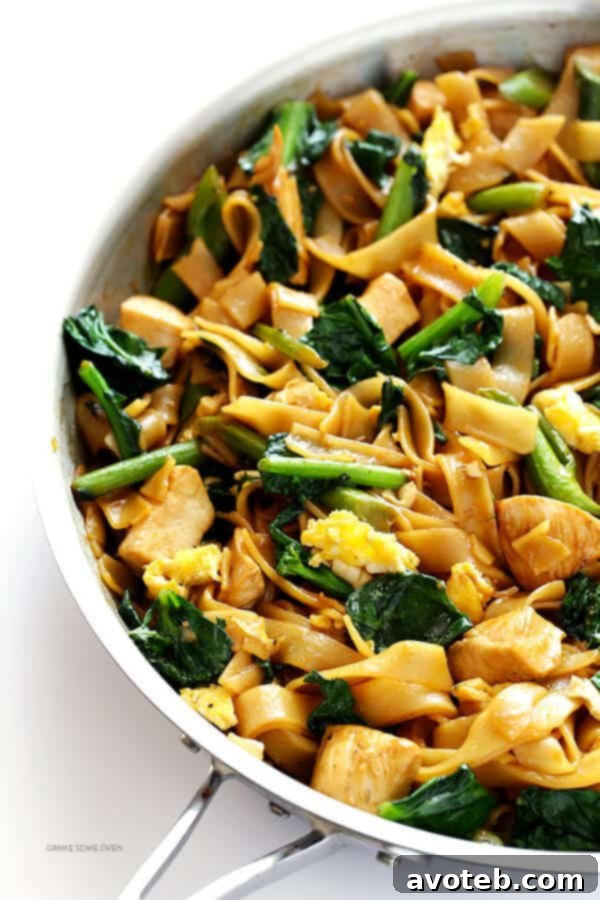 Classic Pad See Ew with wide rice noodles, Chinese broccoli, and chicken, ready to be enjoyed.