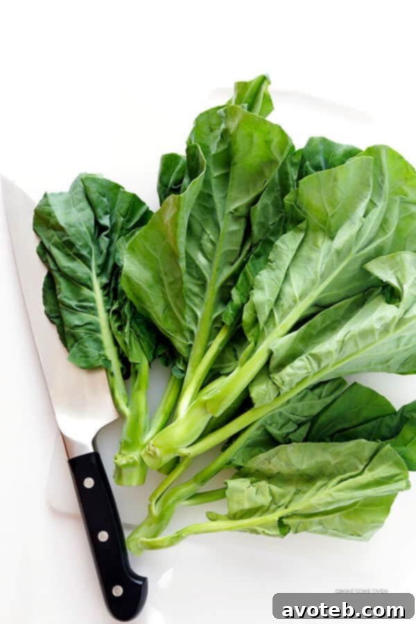 Fresh Chinese broccoli (Gai Lan), a key ingredient for authentic Pad See Ew, showing both tender leaves and crunchy stems.