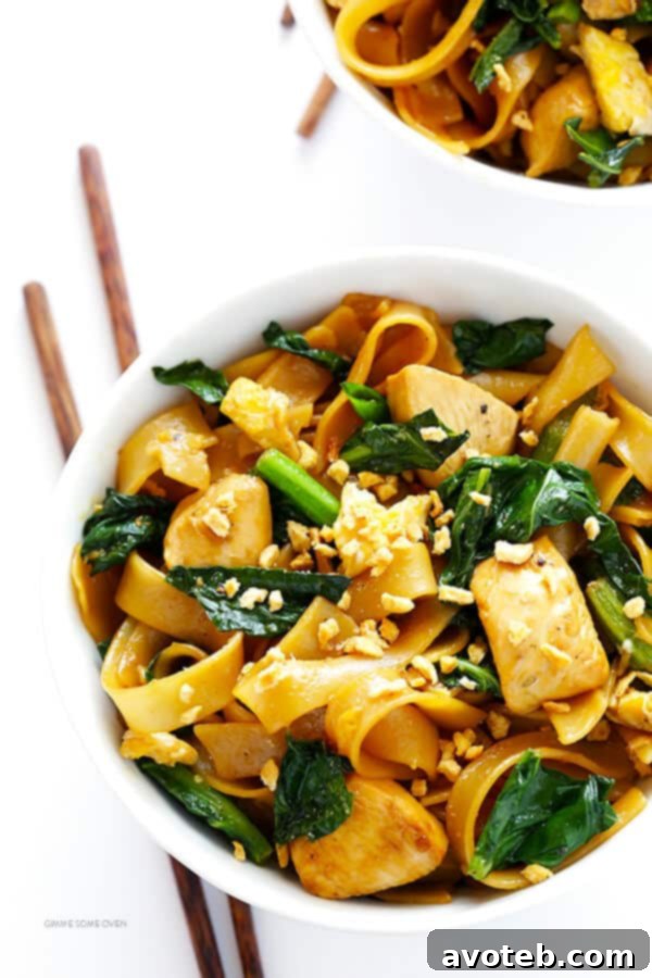 A delicious bowl of homemade Pad See Ew, garnished and ready to serve.