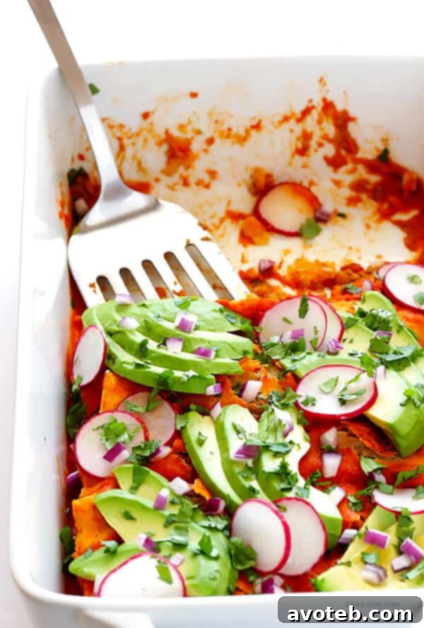 Ultimate Vegan Enchiladas 7 A plate of homemade vegan enchiladas ready to be enjoyed, garnished with fresh toppings.