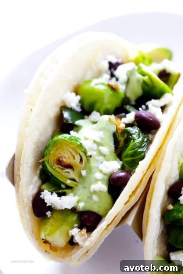 Assembling Brussels Sprouts Tacos with avocado sauce
