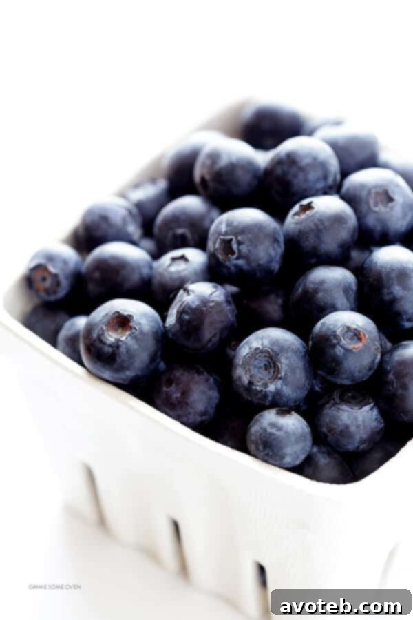Fresh blueberries and vibrant green limes, essential ingredients for crafting the perfect blueberry margarita.