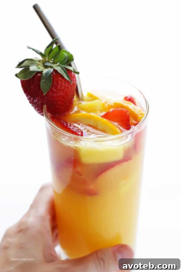 Mimosa Sangria -- quick and easy to make, and kicked up a notch with lots of delicious fresh fruit!