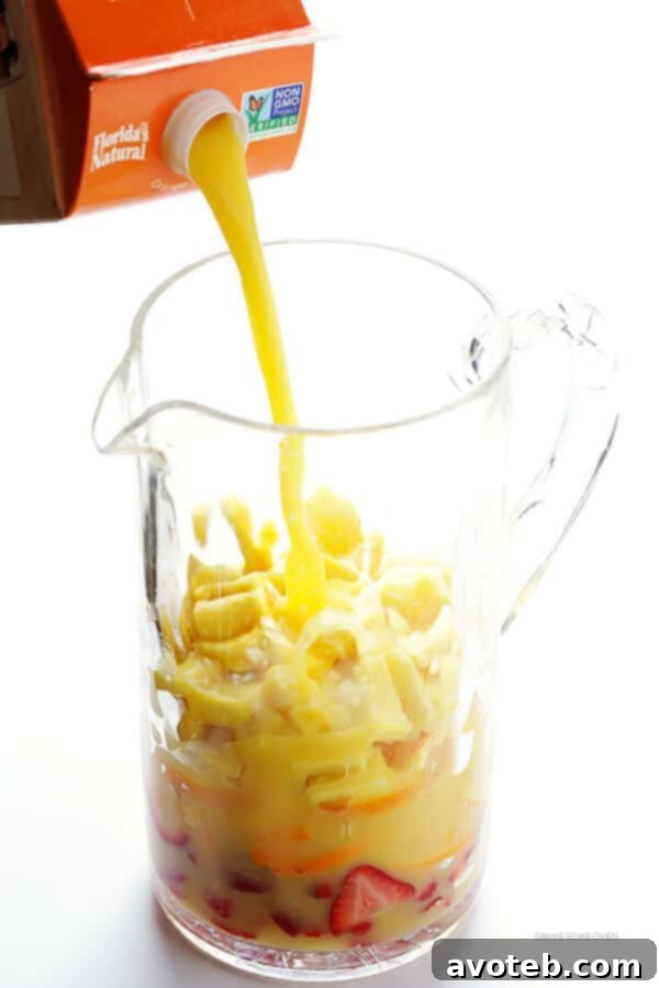 Mimosa Sangria -- quick and easy to make, and kicked up a notch with lots of delicious fresh fruit!