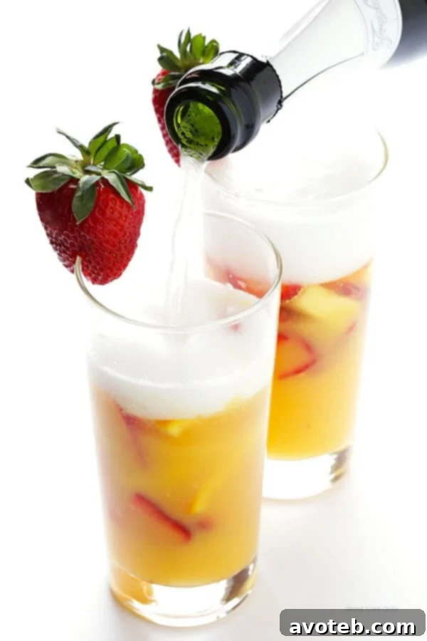 Mimosa Sangria -- quick and easy to make, and kicked up a notch with lots of delicious fresh fruit!