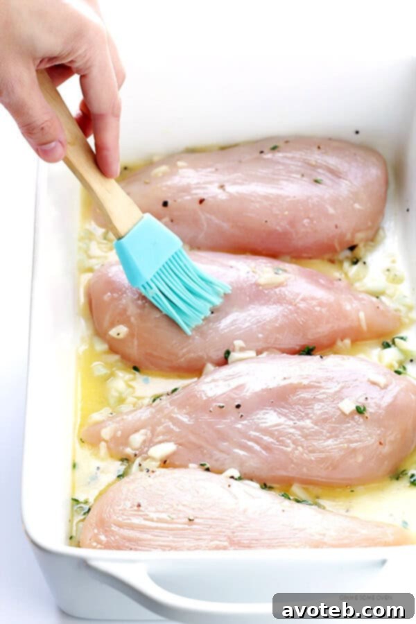 Ingredients for baked lemon chicken: lemon, garlic, thyme, and butter