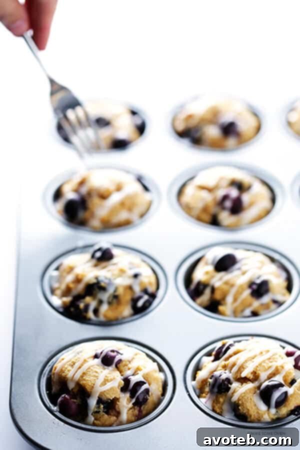 A bowl of freshly prepared Honey Lemon Glaze, ready to be drizzled over the warm blueberry muffins. | gimmesomeoven.com