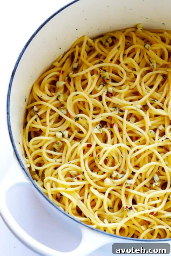 Bold Garlic Spaghetti 4 Close-up of garlic sautéing in butter, forming the base of a delicious spaghetti sauce.