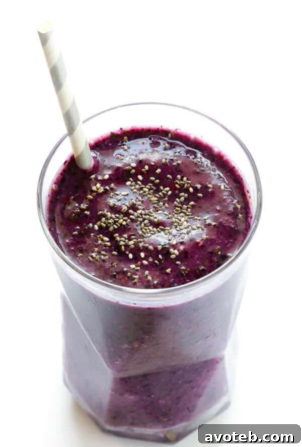 Blueberry kale smoothie being blended to a smooth consistency.