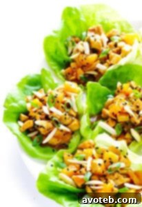 A vibrant recipe card image for Orange Chicken Lettuce Wraps.