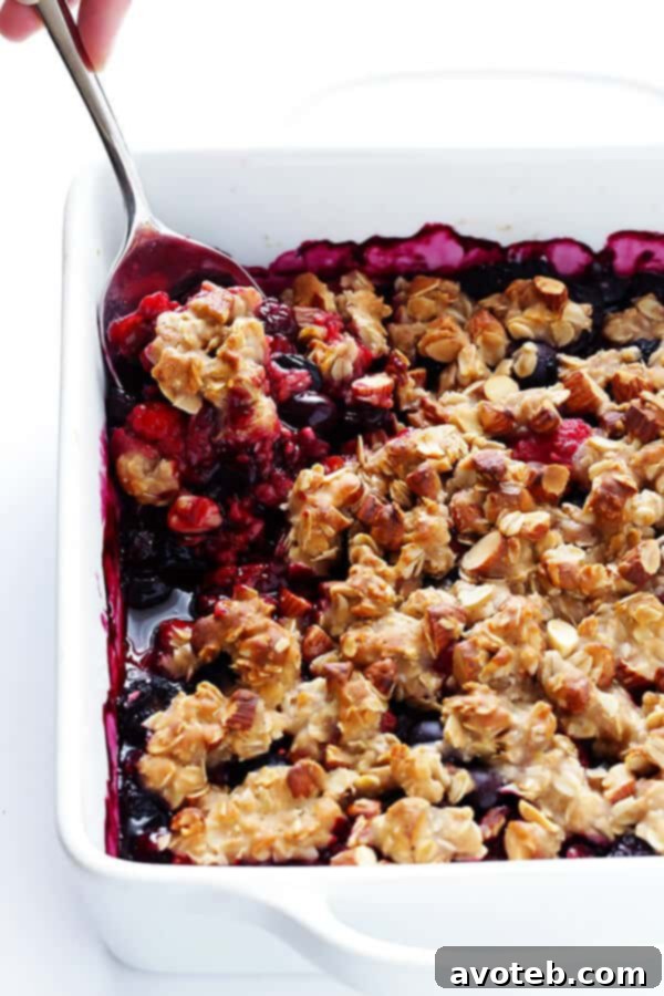 Freshly baked Berry Almond Crisp, golden brown and bubbling with warm berries.
