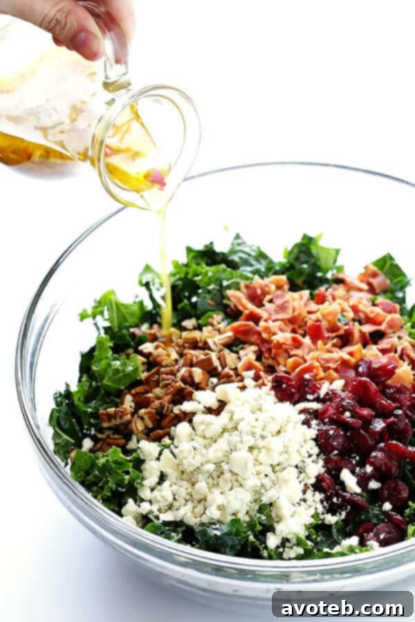 Smoky Bacon & Bold Blue Cheese Kale Salad 4 The delicious components of Kale Salad: massaged kale, blue cheese, bacon, cranberries, and toasted pecans, ready to be dressed.