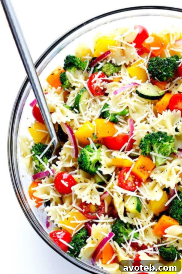 The finished Veggie Lovers' Pasta Salad, garnished with fresh herbs, ready to be served and enjoyed.