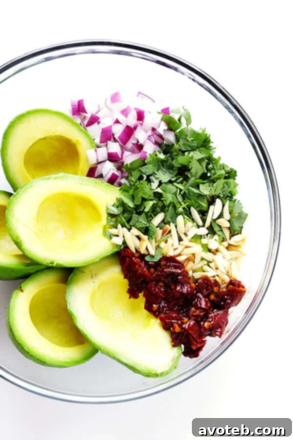 This Toasted Almond and Chipotle Guacamole recipe is easy to make in about 10 minutes, and it's absolutely IRRESISTIBLE. Trust me. | gimmesomeoven.com (Vegan + Gluten Free)