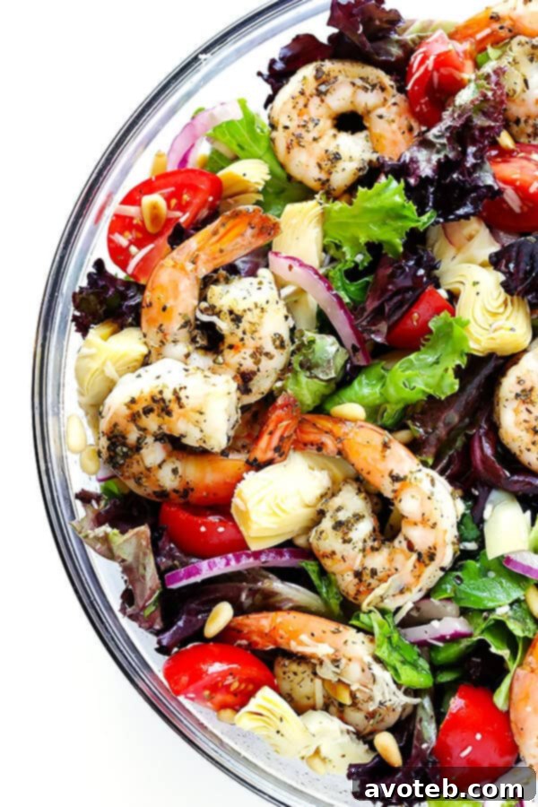 Vibrant Shrimp and Artichoke Salad with Zesty Lemon Dressing 2 This Shrimp and Artichoke Green Salad is made with easy Italian-herb shrimp, artichoke hearts, tomatoes, pine nuts, and then it's tossed in a zesty lemon vinaigrette. It's one of my all-time favorite salads! | gimmesomeoven.com