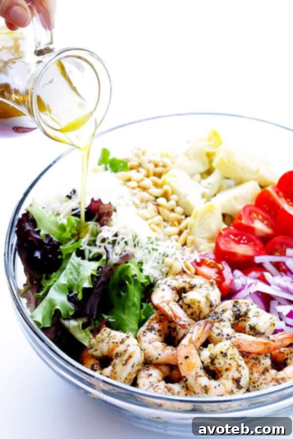 Vibrant Shrimp and Artichoke Salad with Zesty Lemon Dressing 5 This Shrimp and Artichoke Green Salad is made with easy Italian-herb shrimp, artichoke hearts, tomatoes, pine nuts, and then it's tossed in a zesty lemon vinaigrette. It's one of my all-time favorite salads! | gimmesomeoven.com