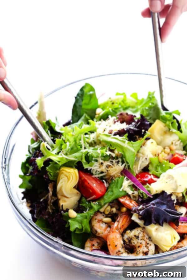 Vibrant Shrimp and Artichoke Salad with Zesty Lemon Dressing 6 This Shrimp and Artichoke Green Salad is made with easy Italian-herb shrimp, artichoke hearts, tomatoes, pine nuts, and then it's tossed in a zesty lemon vinaigrette. It's one of my all-time favorite salads! | gimmesomeoven.com