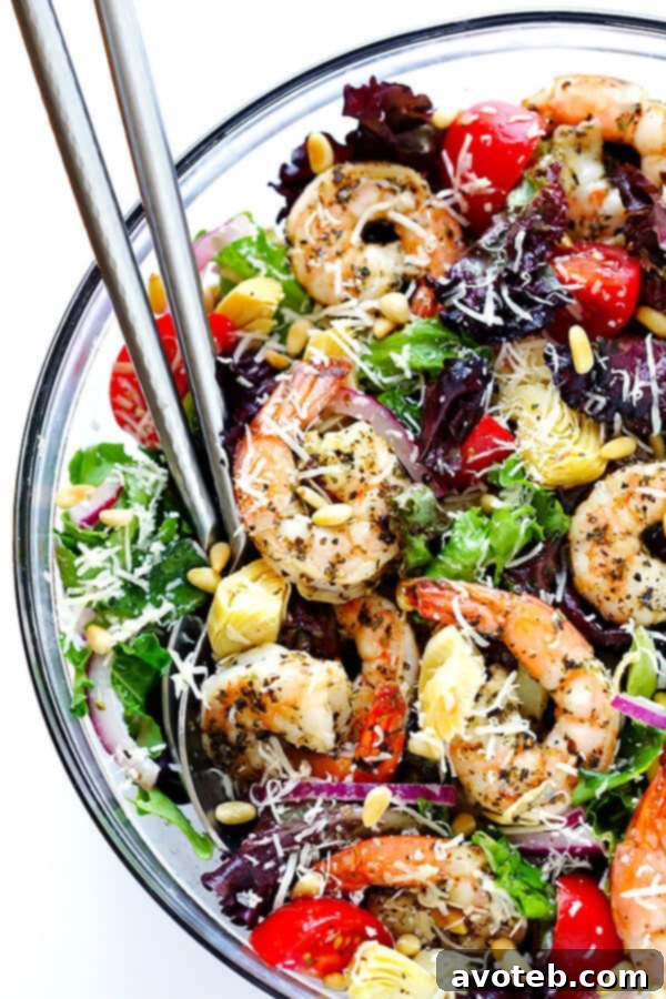 Vibrant Shrimp and Artichoke Salad with Zesty Lemon Dressing 7 This Shrimp and Artichoke Green Salad is made with easy Italian-herb shrimp, artichoke hearts, tomatoes, pine nuts, and then it's tossed in a zesty lemon vinaigrette. It's one of my all-time favorite salads! | gimmesomeoven.com
