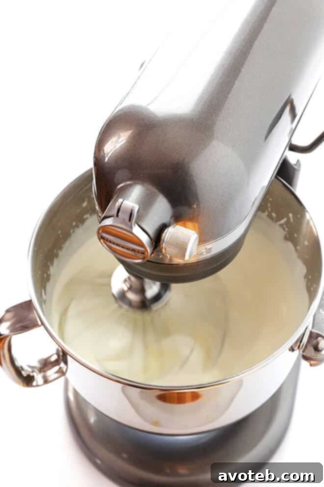 Ingredients for Homemade Whipped Cream: Chilled heavy cream, powdered sugar, and vanilla extract ready to be whipped.