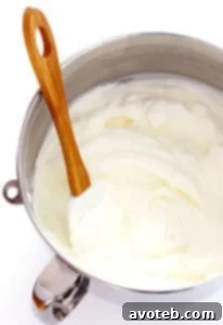 A bowl of freshly made homemade whipped cream, ready to be served on desserts.