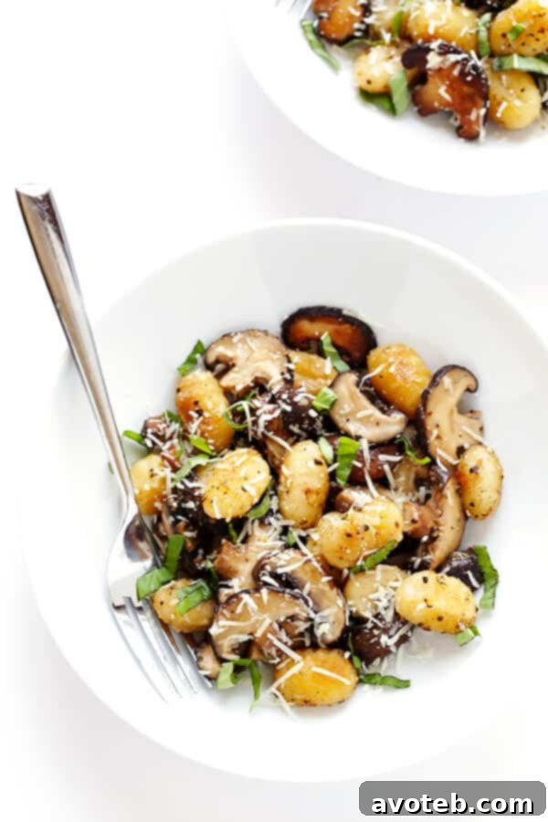 Freshly cooked Gnocchi with sautéed mushrooms, fragrant basil, and rich Parmesan cheese, perfect for a quick dinner.
