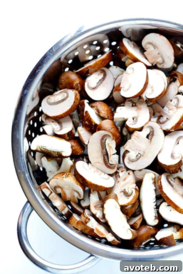 Close-up of golden-brown toasted gnocchi mixed with perfectly sautéed mushrooms and fresh herbs.