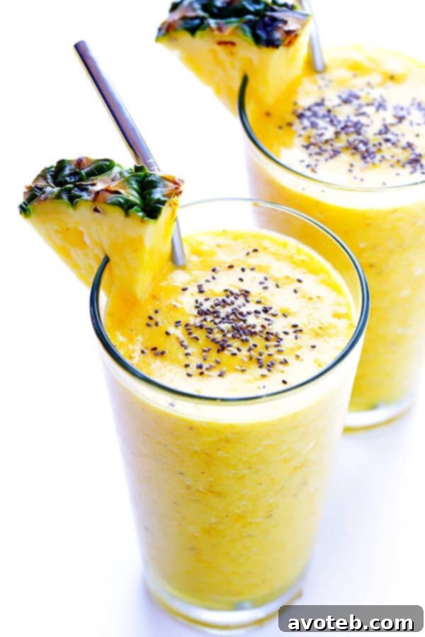 Feel-Good Pineapple Smoothie garnished with chia seeds and a pineapple slice.