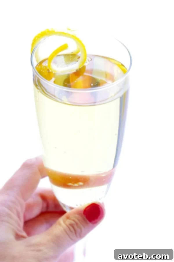 Alternative French 75 Cocktail with Lime and Mint Garnish in a different glass