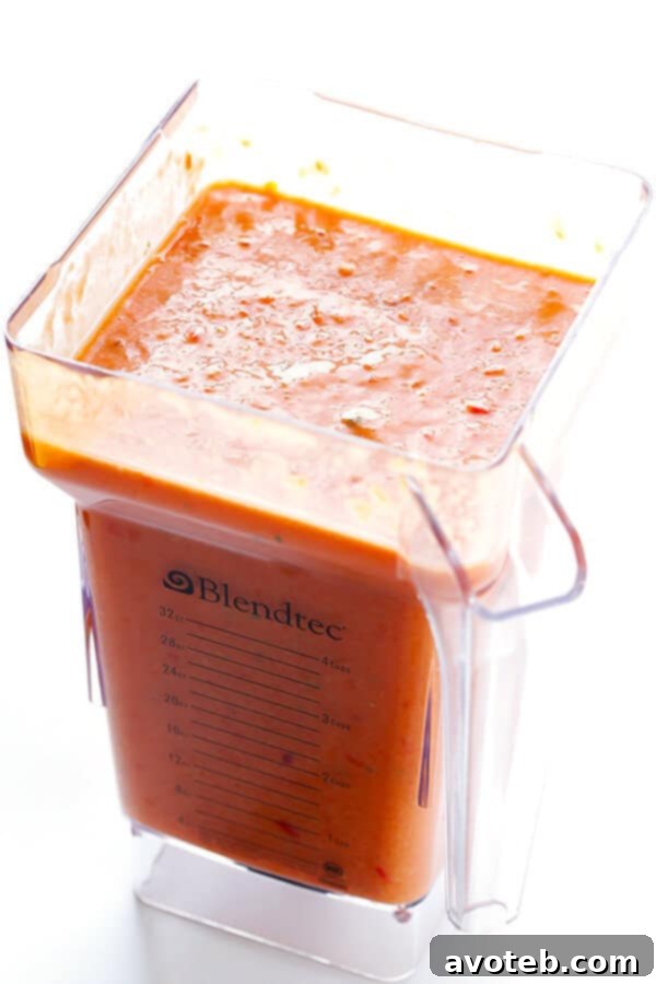 Speedy Summer Gazpacho 6 A blend of fresh vegetables and herbs in a food processor, transforming into a smooth and vibrant gazpacho, ready for a quick and healthy meal.