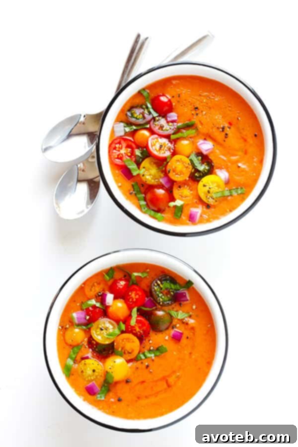 Speedy Summer Gazpacho 8 A bowl of vibrant gazpacho garnished with fresh herbs and diced vegetables, ready to be enjoyed as a light and refreshing summer meal.
