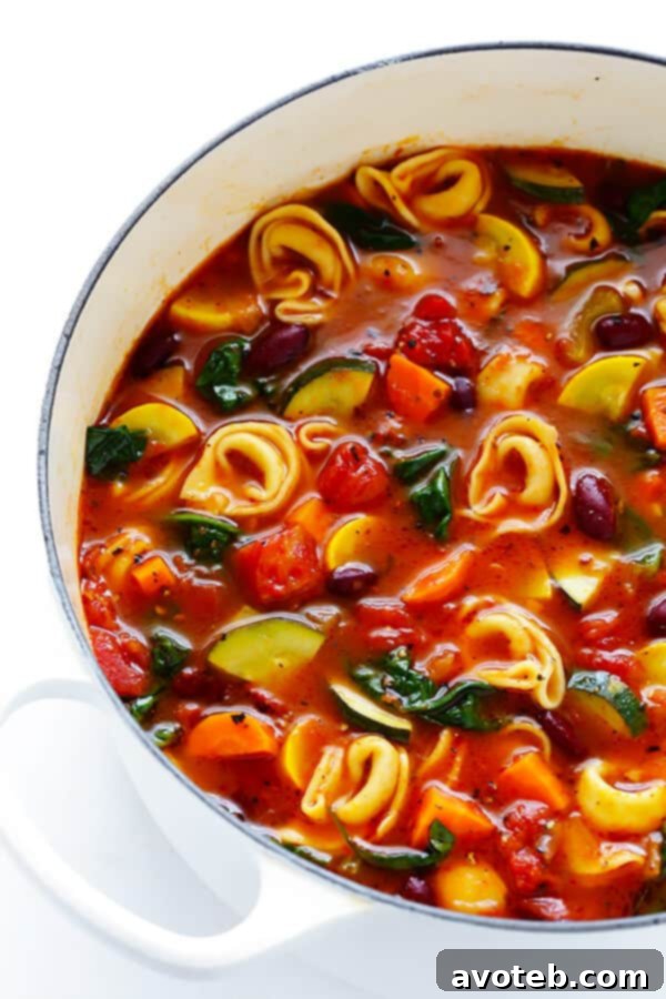 Comforting Tortellini Minestrone 2 A steaming bowl of Tortellini Minestrone, rich with colorful vegetables and cheese-filled tortellini, perfect for a cozy meal.