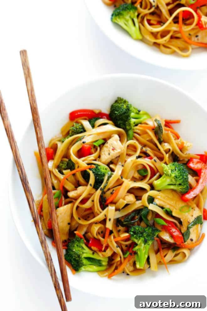 This 30-Minute Sesame Chicken Noodle Stir-Fry recipe is quick and easy to make, easy to customize with whatever fresh veggies or greens you have on hand, and it's tossed with the most delicious sesame-soy vinaigrette! | gimmesomeoven.com