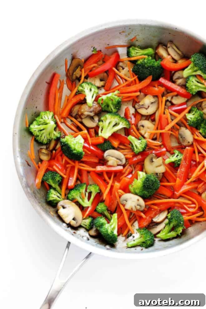This 30-Minute Sesame Chicken Noodle Stir-Fry recipe is quick and easy to make, easy to customize with whatever fresh veggies or greens you have on hand, and it's tossed with the most delicious sesame-soy vinaigrette! | gimmesomeoven.com