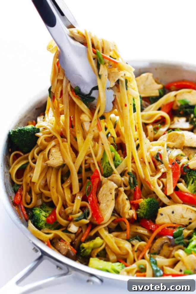 This 30-Minute Sesame Chicken Noodle Stir-Fry recipe is quick and easy to make, easy to customize with whatever fresh veggies or greens you have on hand, and it's tossed with the most delicious sesame-soy vinaigrette! | gimmesomeoven.com