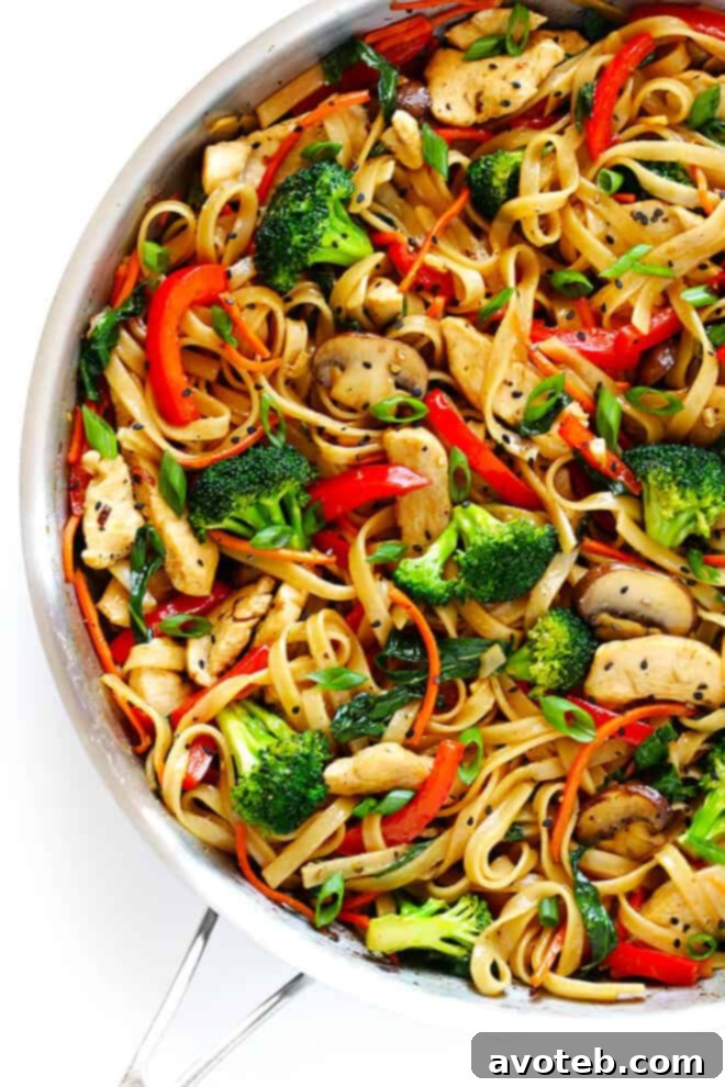 This 30-Minute Sesame Chicken Noodle Stir-Fry recipe is quick and easy to make, easy to customize with whatever fresh veggies or greens you have on hand, and it's tossed with the most delicious sesame-soy vinaigrette! | gimmesomeoven.com