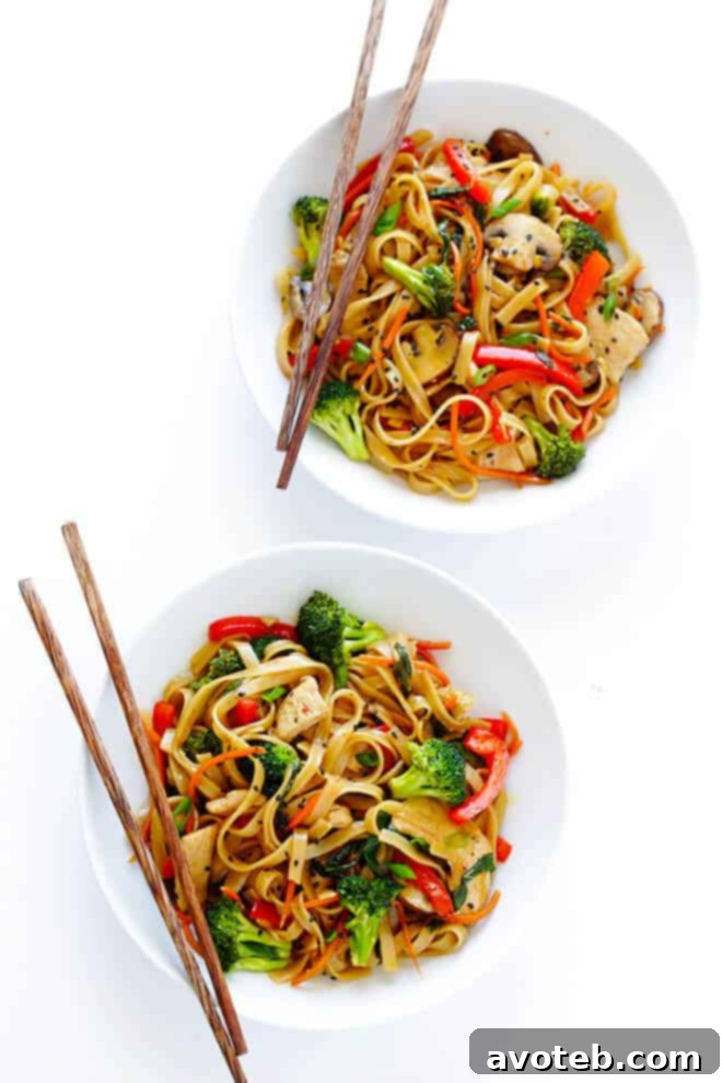 This 30-Minute Sesame Chicken Noodle Stir-Fry recipe is quick and easy to make, easy to customize with whatever fresh veggies or greens you have on hand, and it's tossed with the most delicious sesame-soy vinaigrette! | gimmesomeoven.com