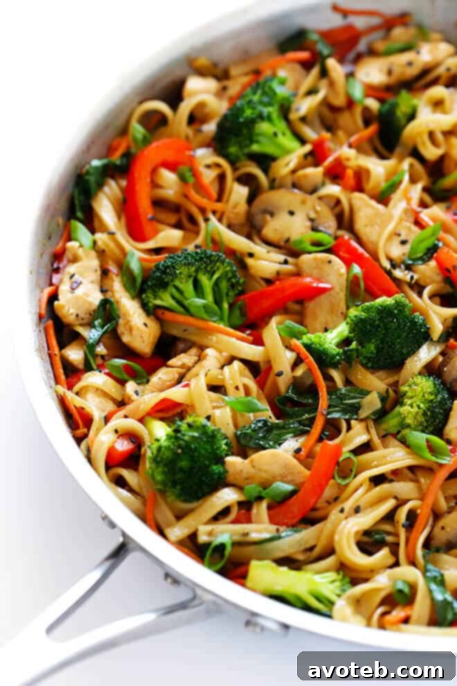 This 30-Minute Sesame Chicken Noodle Stir-Fry recipe is quick and easy to make, easy to customize with whatever fresh veggies or greens you have on hand, and it's tossed with the most delicious sesame-soy vinaigrette! | gimmesomeoven.com