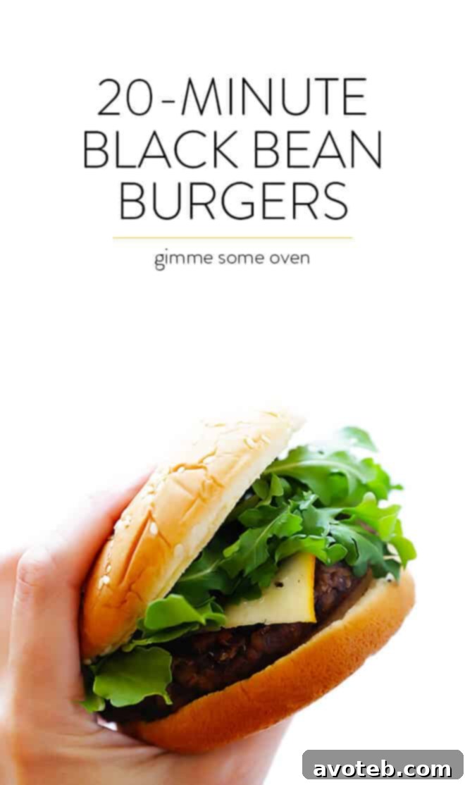 A final shot of the fully assembled 20-Minute Black Bean Burgers with Arla Muenster cheese and fresh arugula, ready to be enjoyed. | gimmesomeoven.com