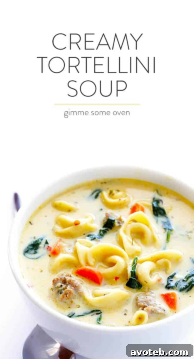 Velvety Italian Sausage Tortellini Soup 9 A serving of Creamy Tortellini Soup with Italian Sausage in a white bowl, garnished with fresh herbs, ready to be enjoyed. The rich texture and vibrant colors are appealing.