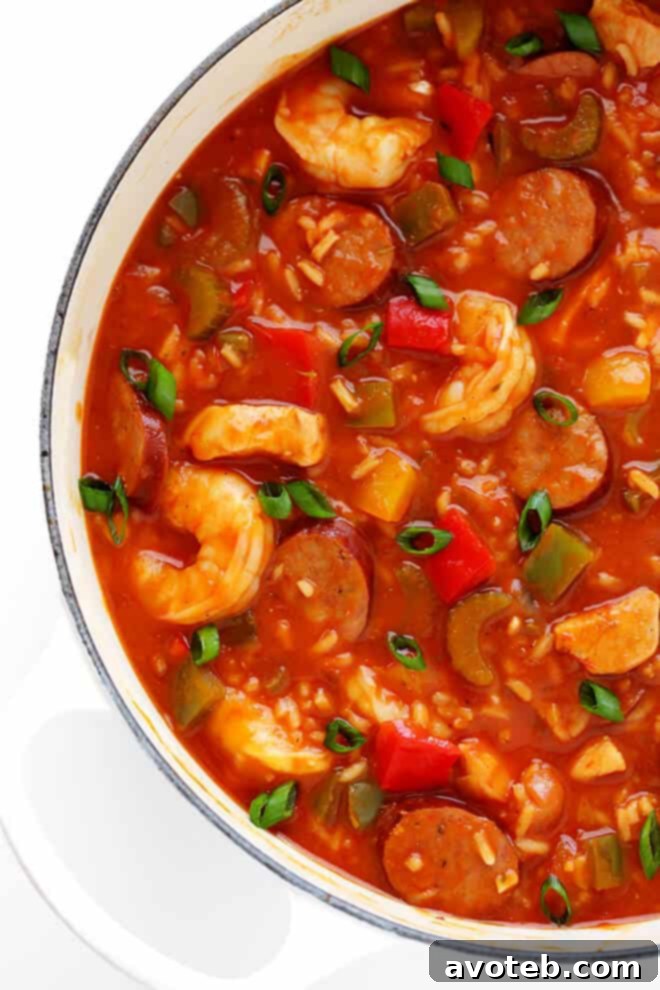 Jambalaya Soup served in a white bowl, garnished with fresh parsley, highlighting its vibrant colors and ingredients