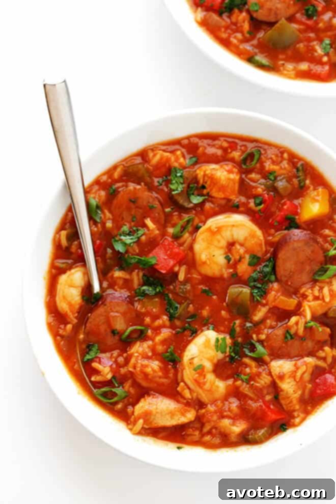 A large pot of Jambalaya Soup simmering on the stove, ready to be served