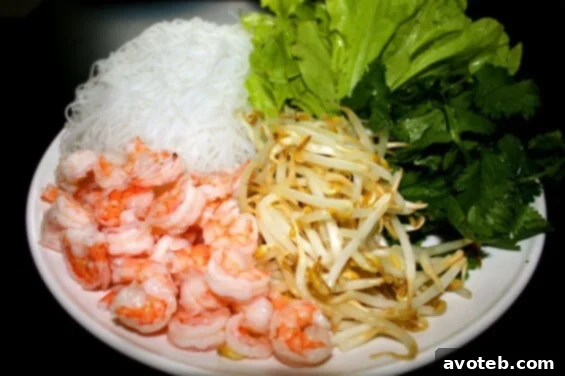 A close-up shot of freshly prepared Vietnamese spring rolls, showcasing the translucent wrapper and colorful fillings.