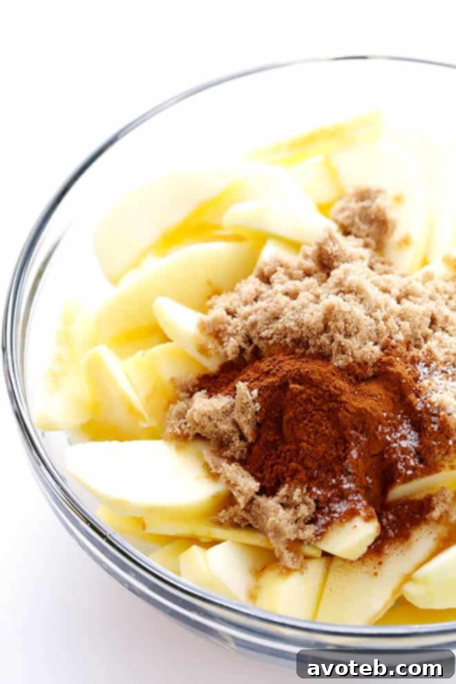 Easy Slow Cooker Apple Crisp with tender cinnamon apples and a crunchy oat-almond topping, perfect for any occasion.