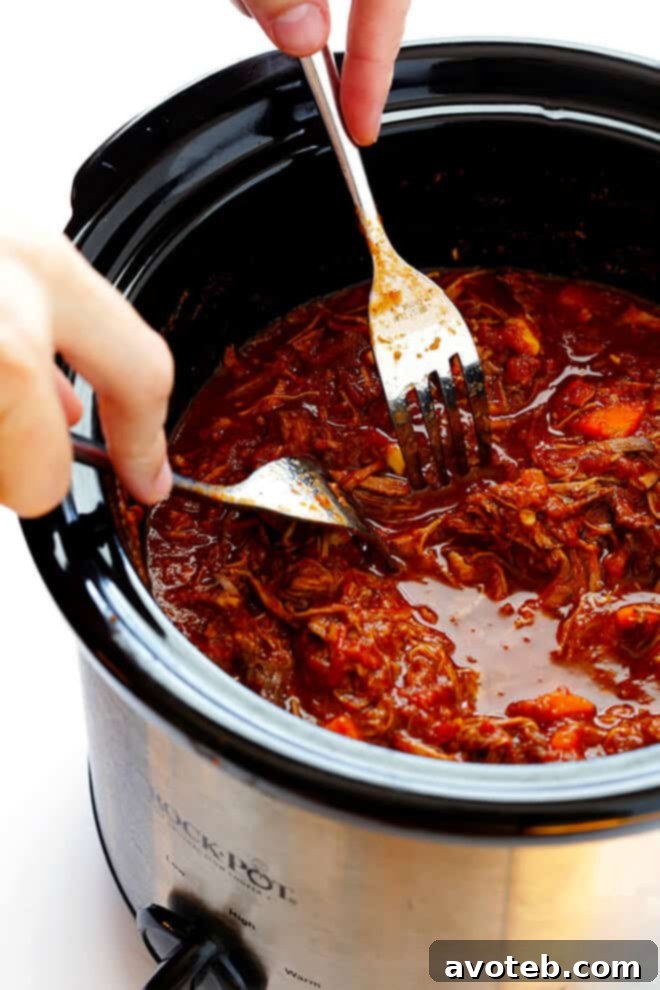 Tender, succulent beef ragu is easily shredded with two forks directly in the slow cooker.