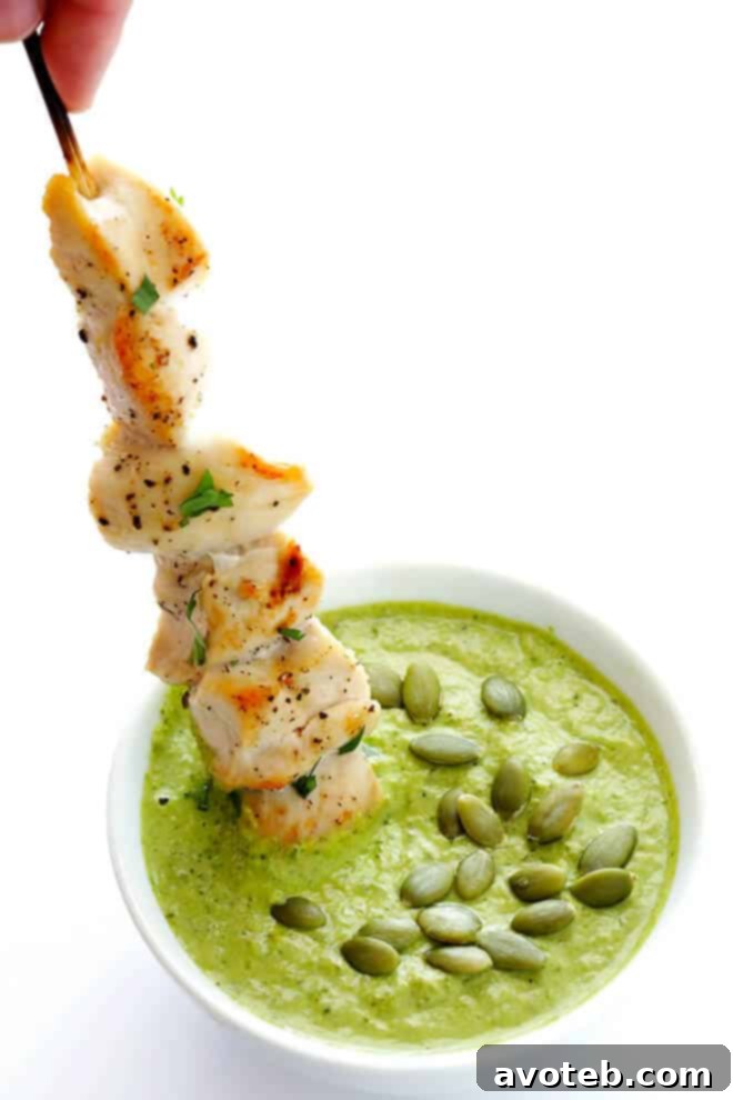 Garnished chicken skewers with pumpkin seed sauce, ready to be enjoyed as a flavorful main dish.