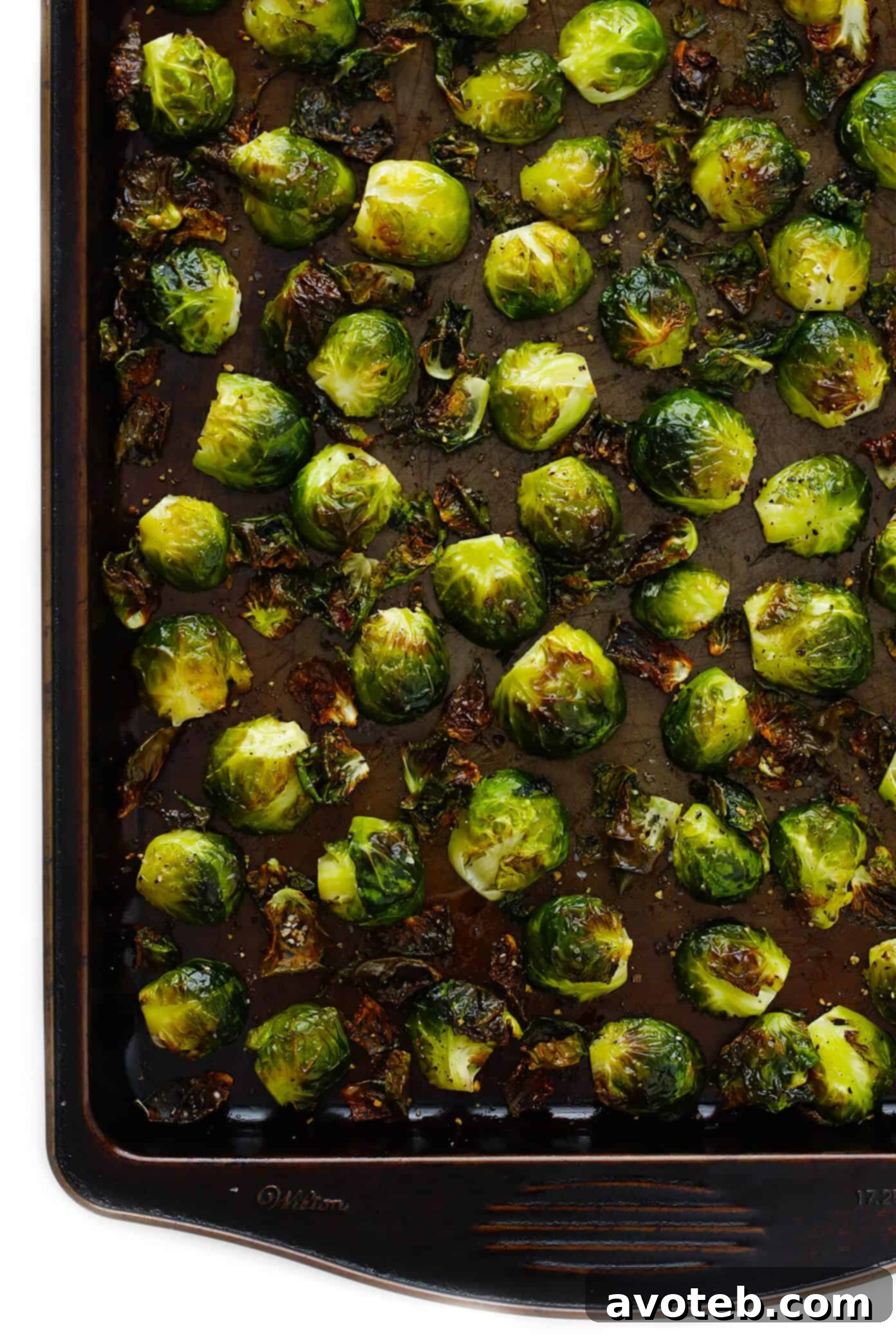 Brussels Sprouts seasoned and arranged on a baking sheet