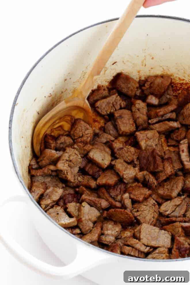 Searing thinly sliced flank steak for homemade Beef Stroganoff Soup