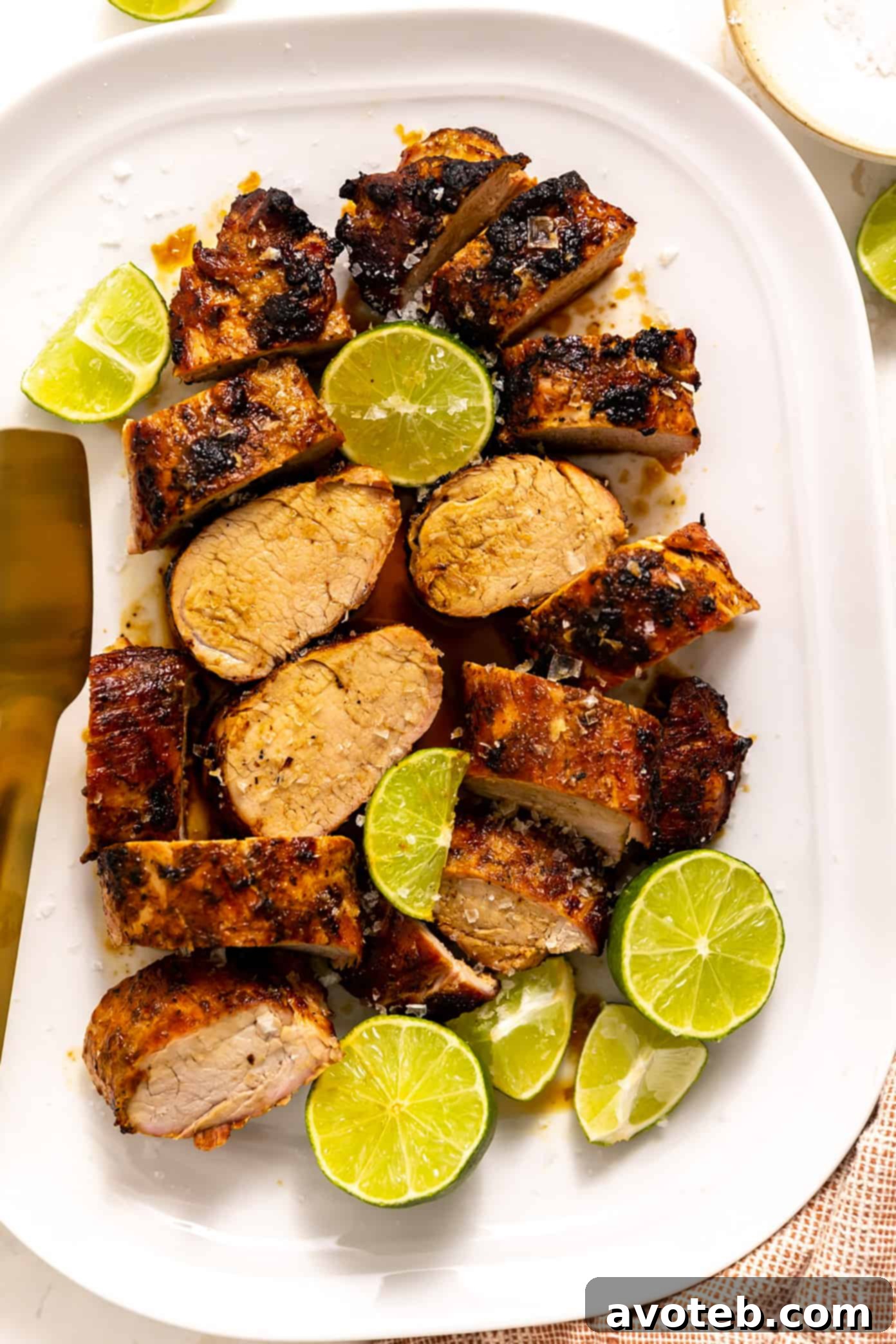 Ginger Lime Pork Tenderloin served alongside rice and fresh herbs