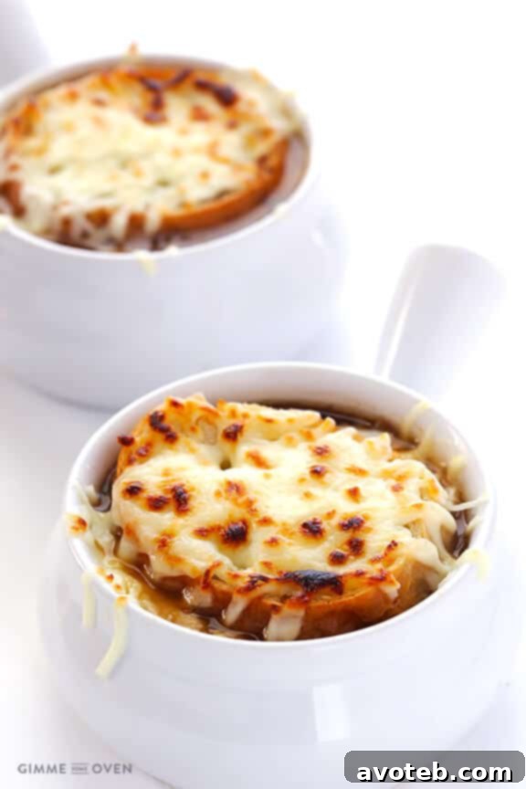 A bowl of classic French Onion Soup, garnished with a cheesy crouton.