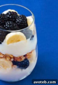 A beautifully layered breakfast parfait in a glass